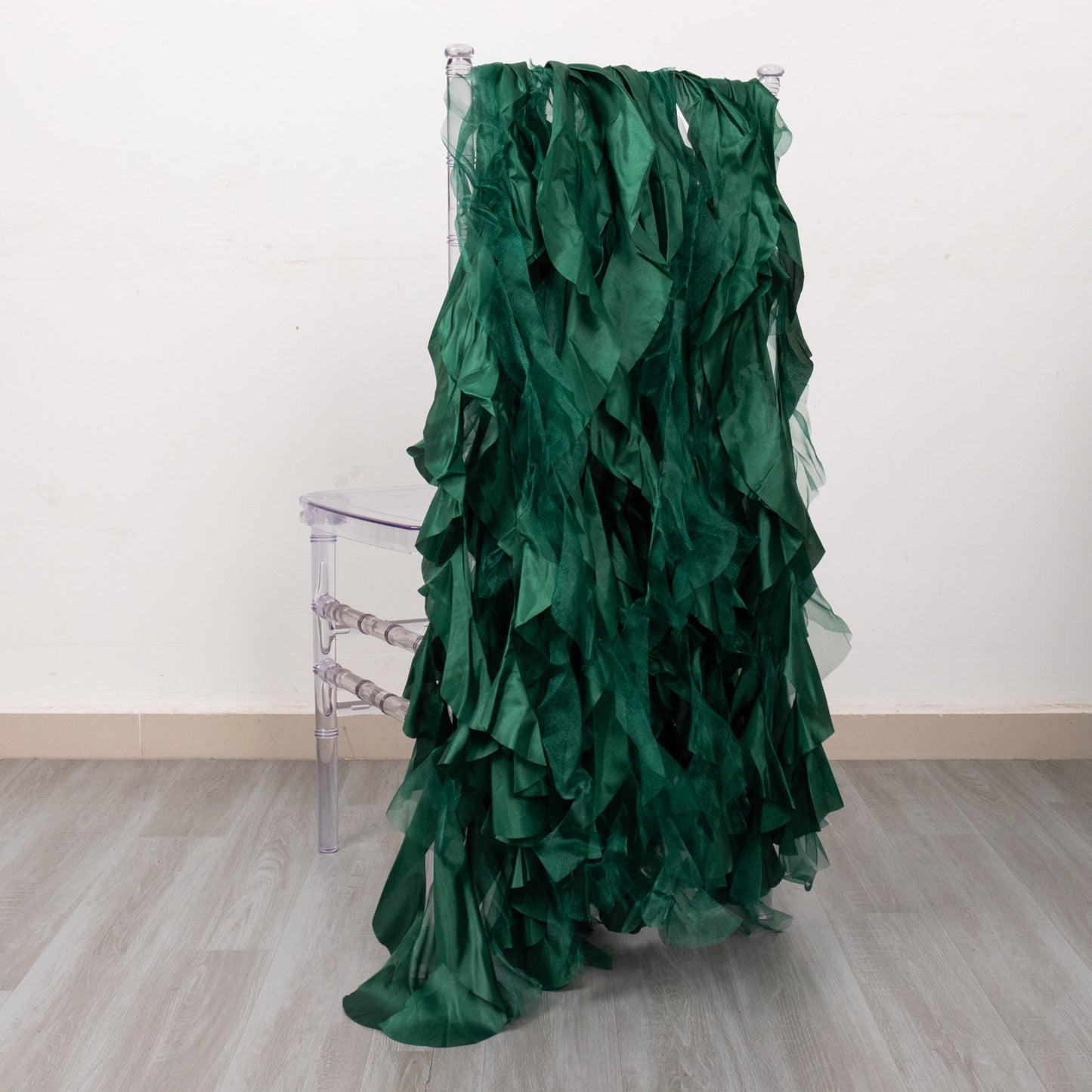 Emerald green curly chiffon satin chair sashes, perfect for elegant events.