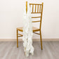 Ivory curly chiffon satin chair sash draped over a golden chair.