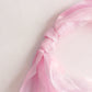 Pink chiffon satin chair sash tied elegantly.