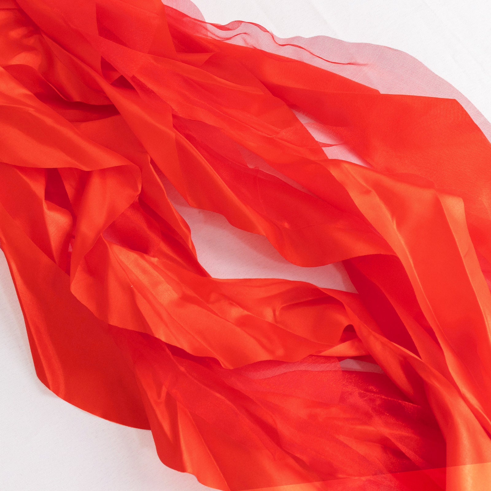 Red chiffon satin chair sashes, perfect for elegant events and decorations.