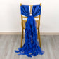 Royal blue chiffon satin chair sashes elegantly draped on a chair.