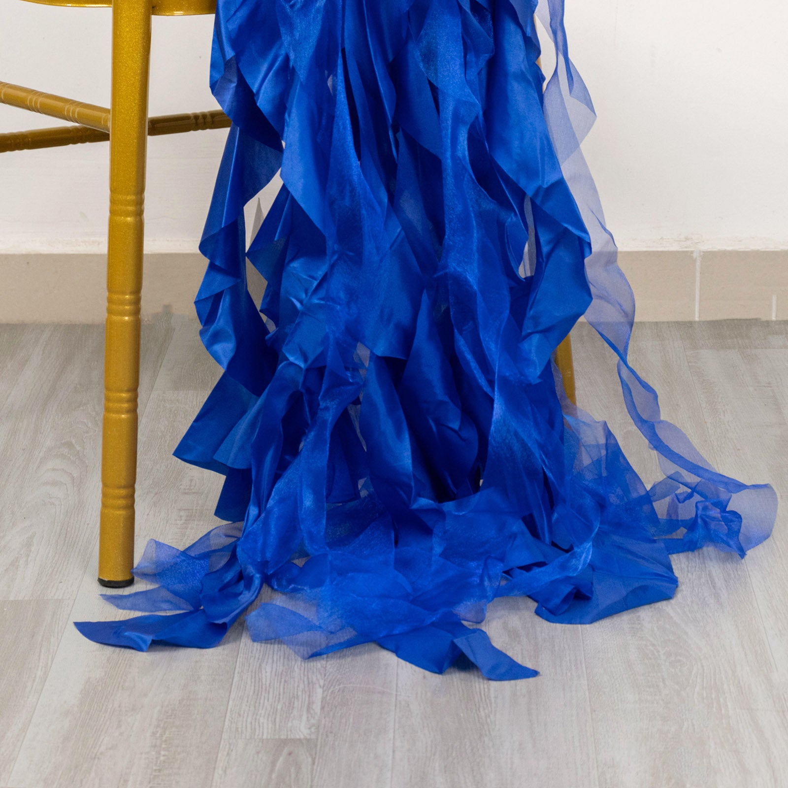 Royal blue curly willow chiffon satin chair sashes draping elegantly.