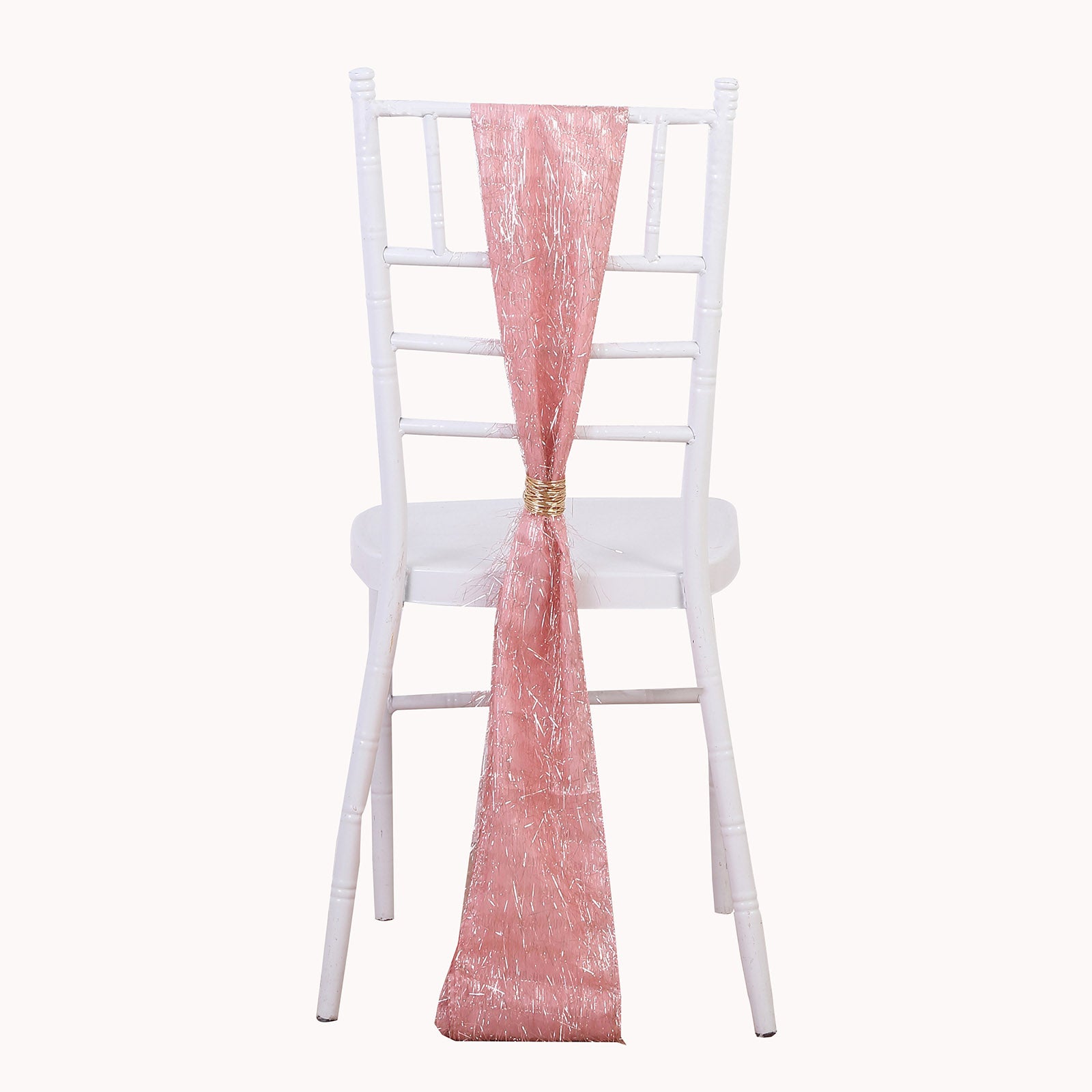 Rose gold metallic fringe tinsel chair sash on a white chair.