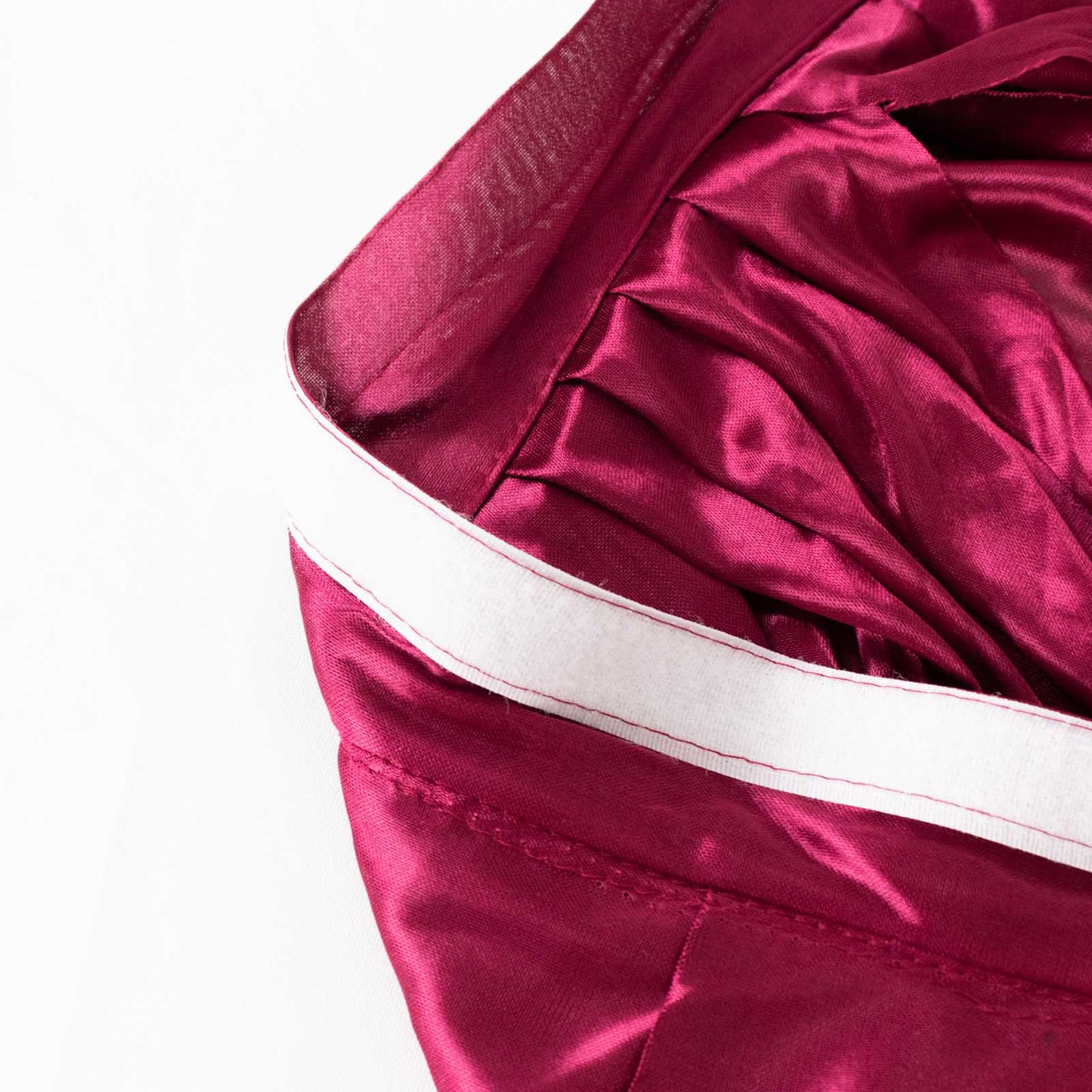 Burgundy pleated satin double drape table skirt.