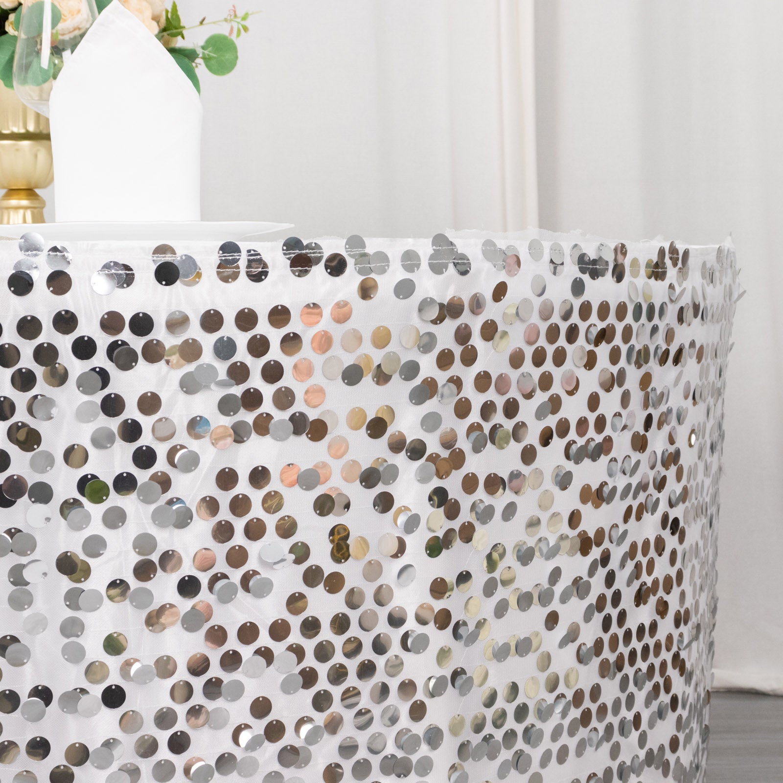 Silver sequin table skirt with dual layered satin, 21ft long.