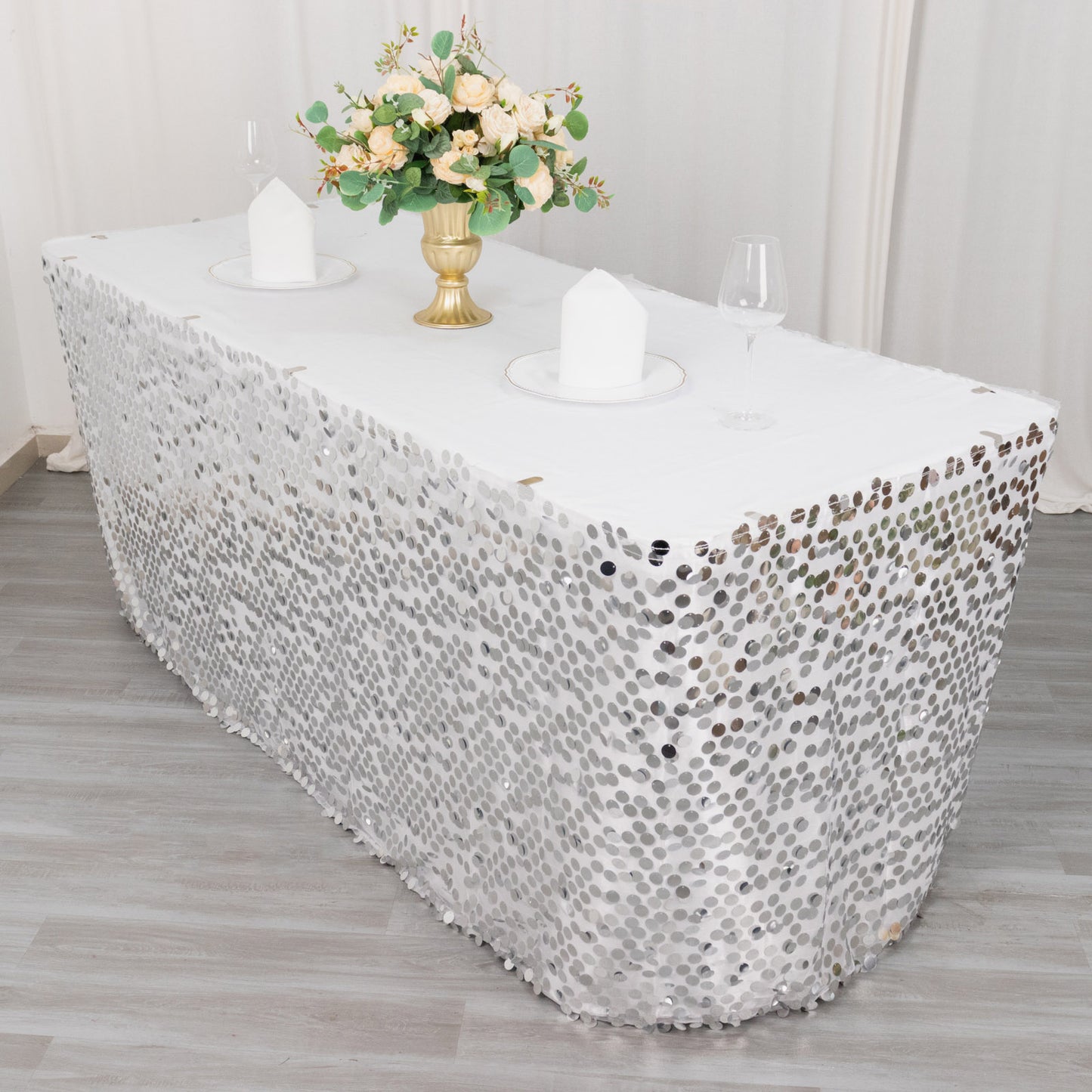 21ft silver sequin table skirt with dual layers on a decorated table.