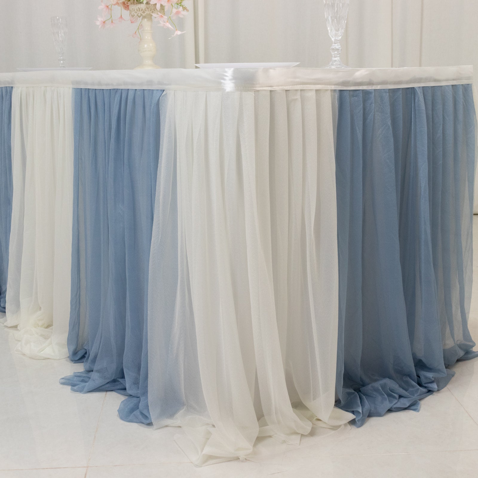 Dusty Blue table skirt with white accents for elegant event decor.