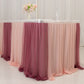 Blush colored table skirt with layered sheer fabric for elegant event decor.