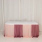 Blush table skirt with gradient draping for elegant event decor.