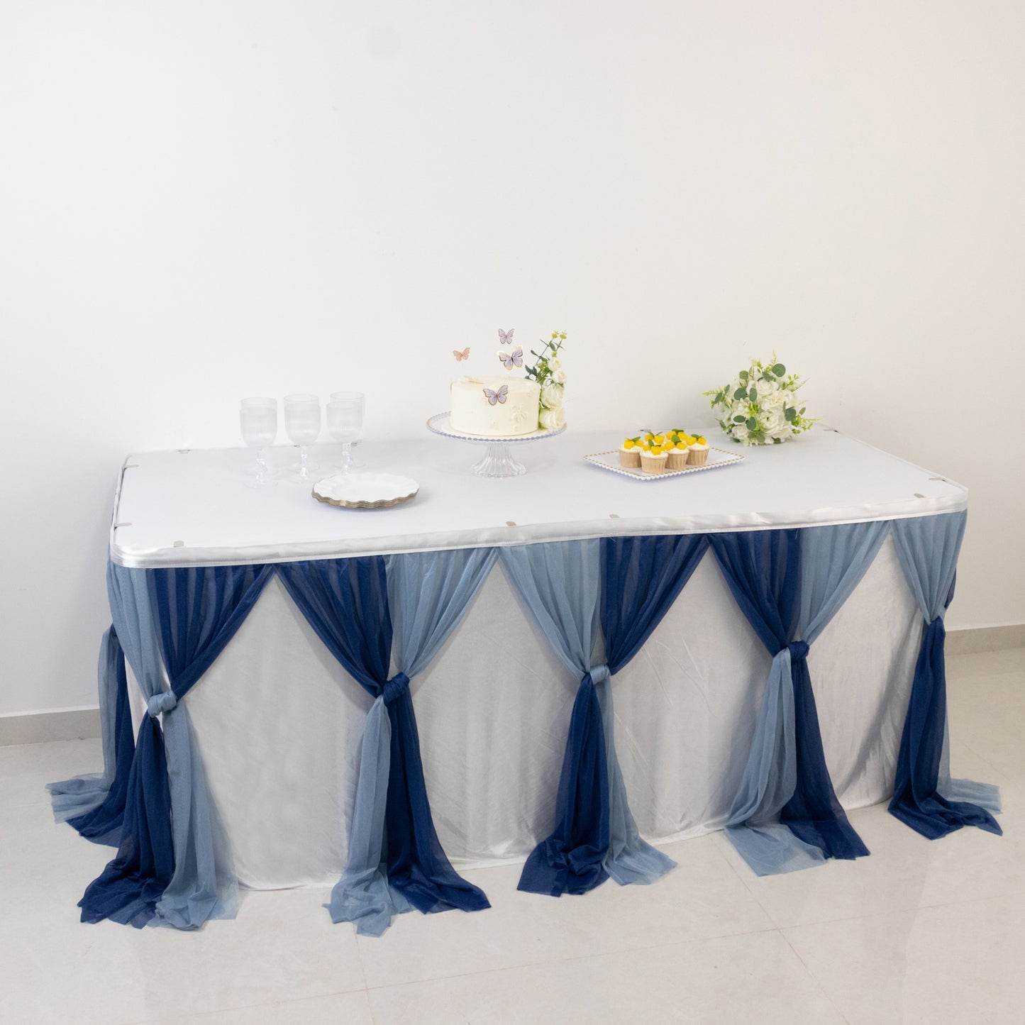 Navy blue and dusty blue chiffon table skirt with pleated ruffles.