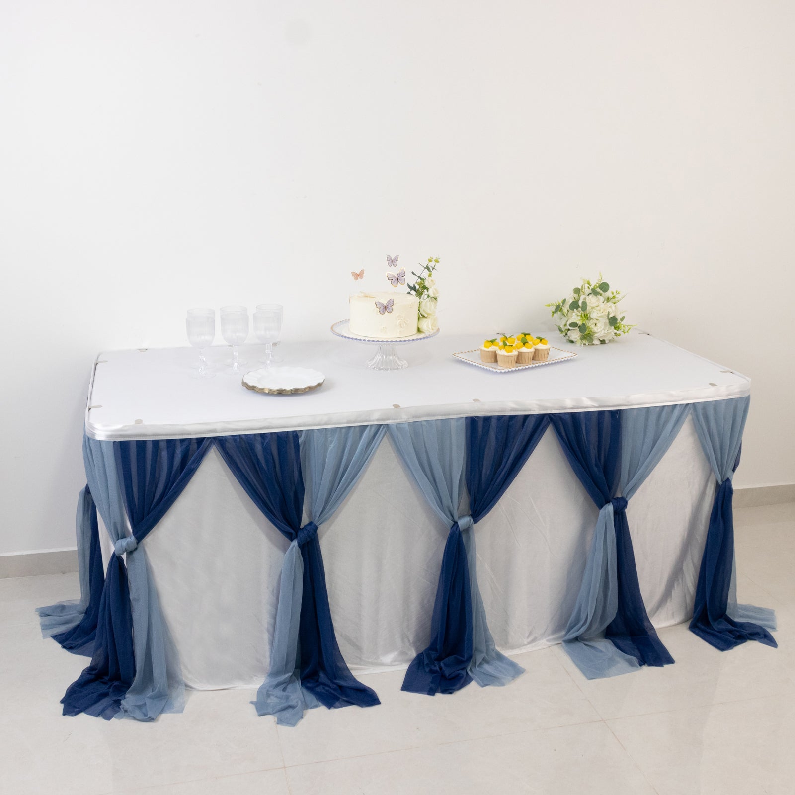 Navy blue and dusty blue chiffon table skirt with pleated ruffles.