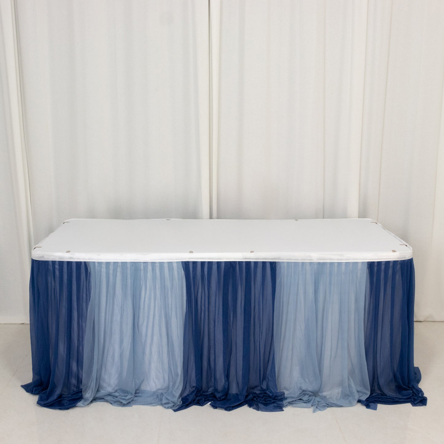 Navy blue and dusty blue chiffon table skirt with sheer pleats.