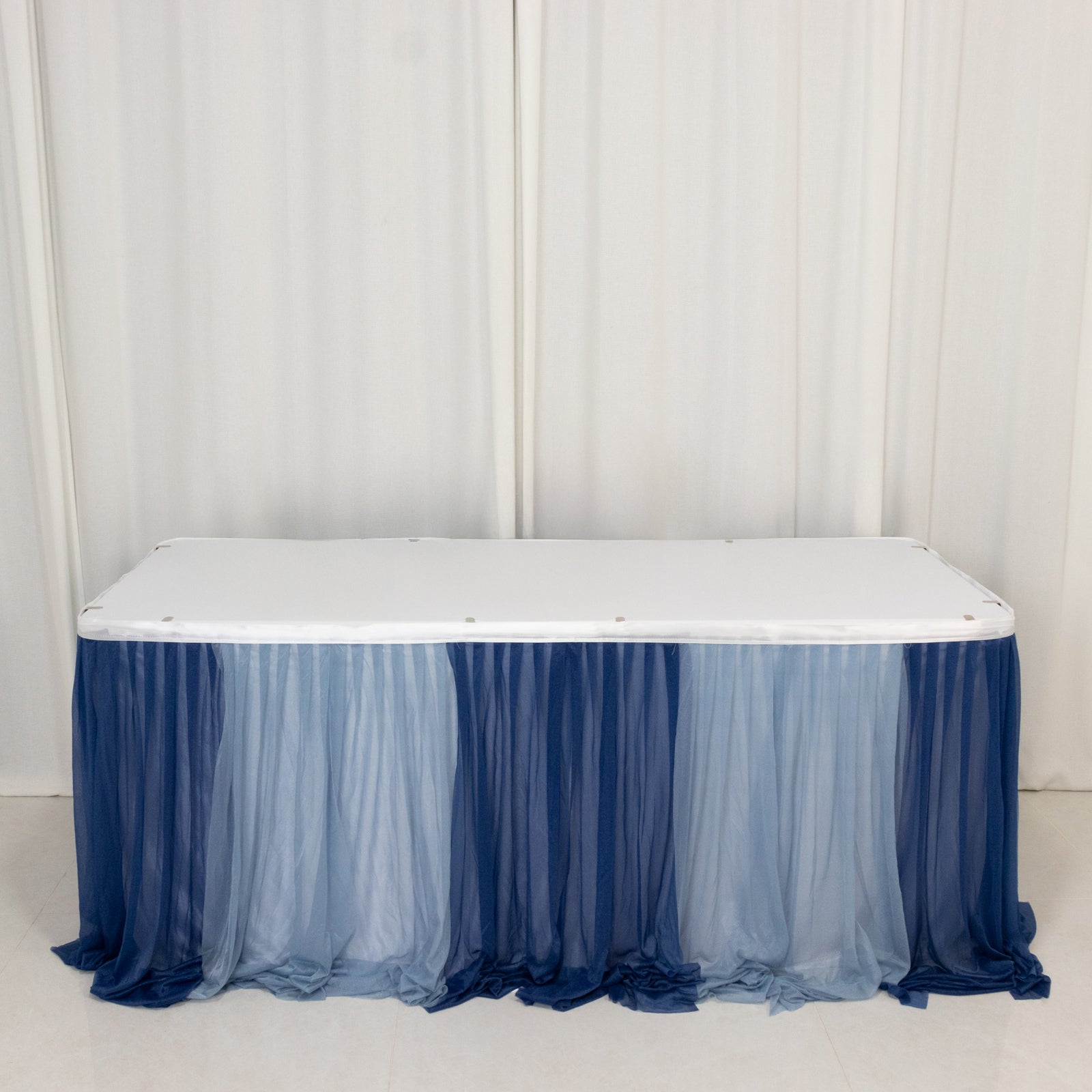 Navy blue and dusty blue chiffon table skirt with sheer pleats.