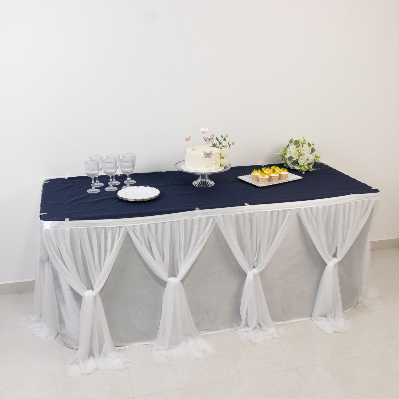 Elegant white table cover with navy accents