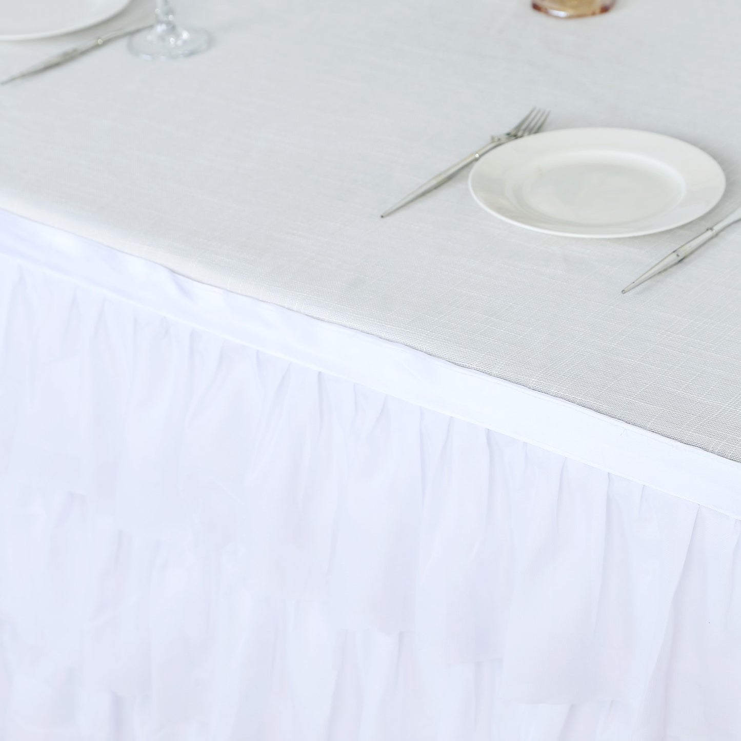Elegant white tablecloth with ruffled skirt