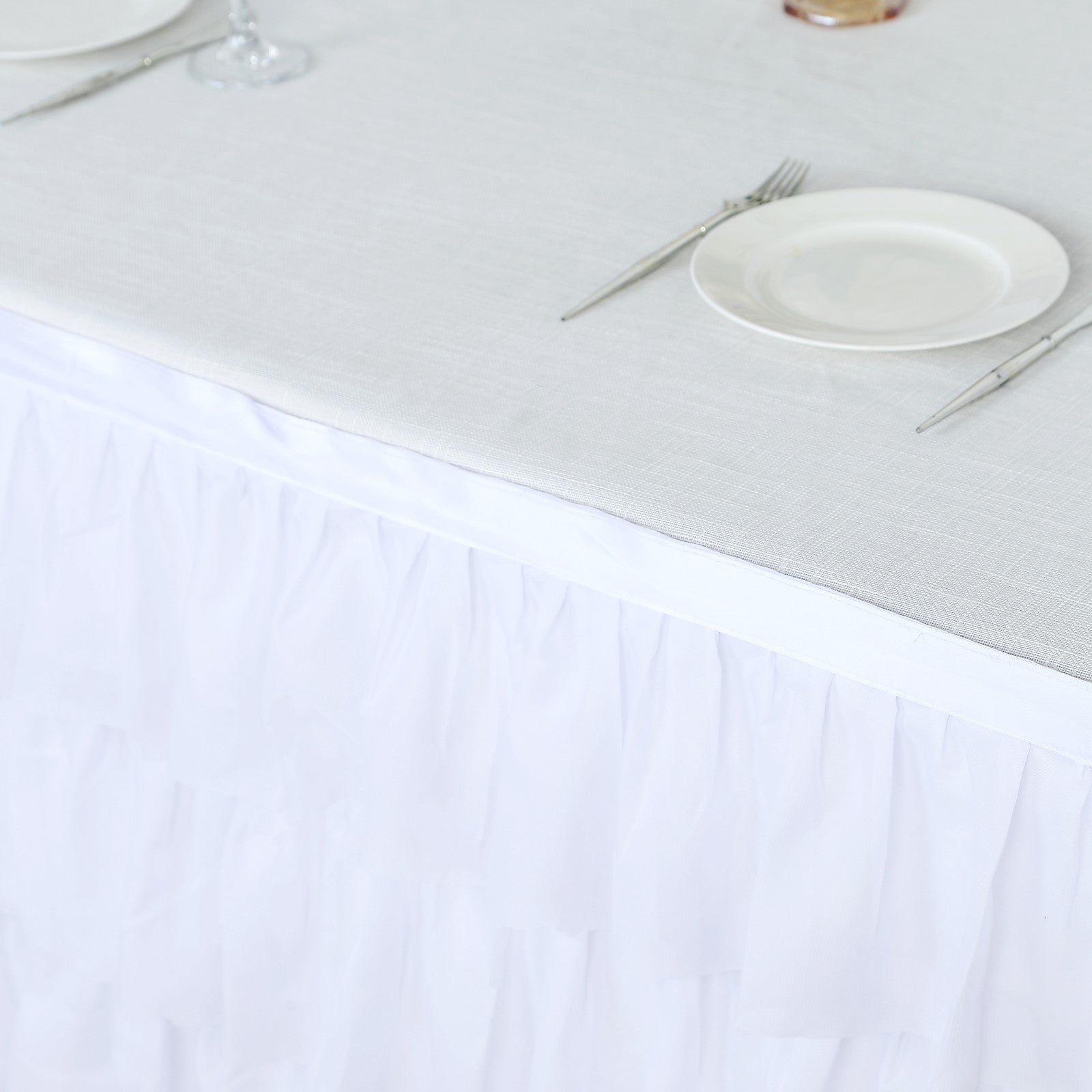 Elegant white tablecloth with ruffled skirt