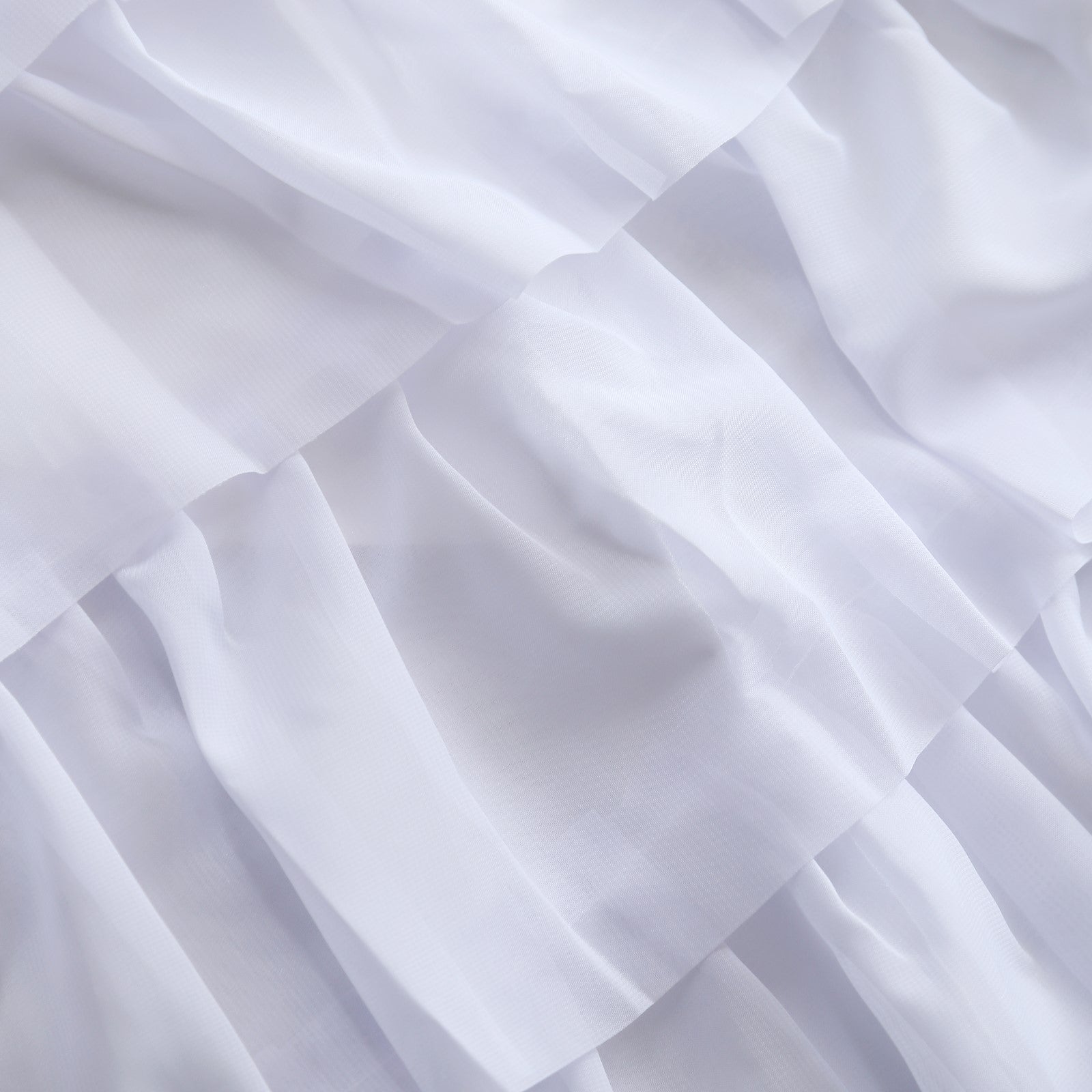 White sheer fabric with textured layers, perfect for elegant designs and décor.