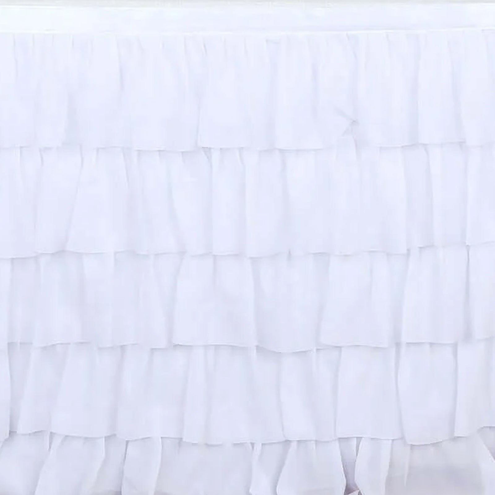 White ruffled table skirt for elegant decor and events. #whtbkgd