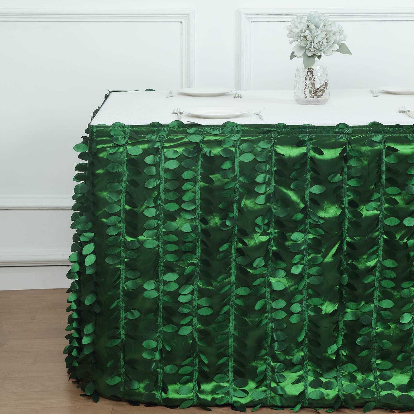 14ft green 3D leaf petal taffeta fabric table skirt on a dining table.