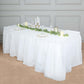 White ruffled plastic table skirt for events, 14ft long, durable and disposable.