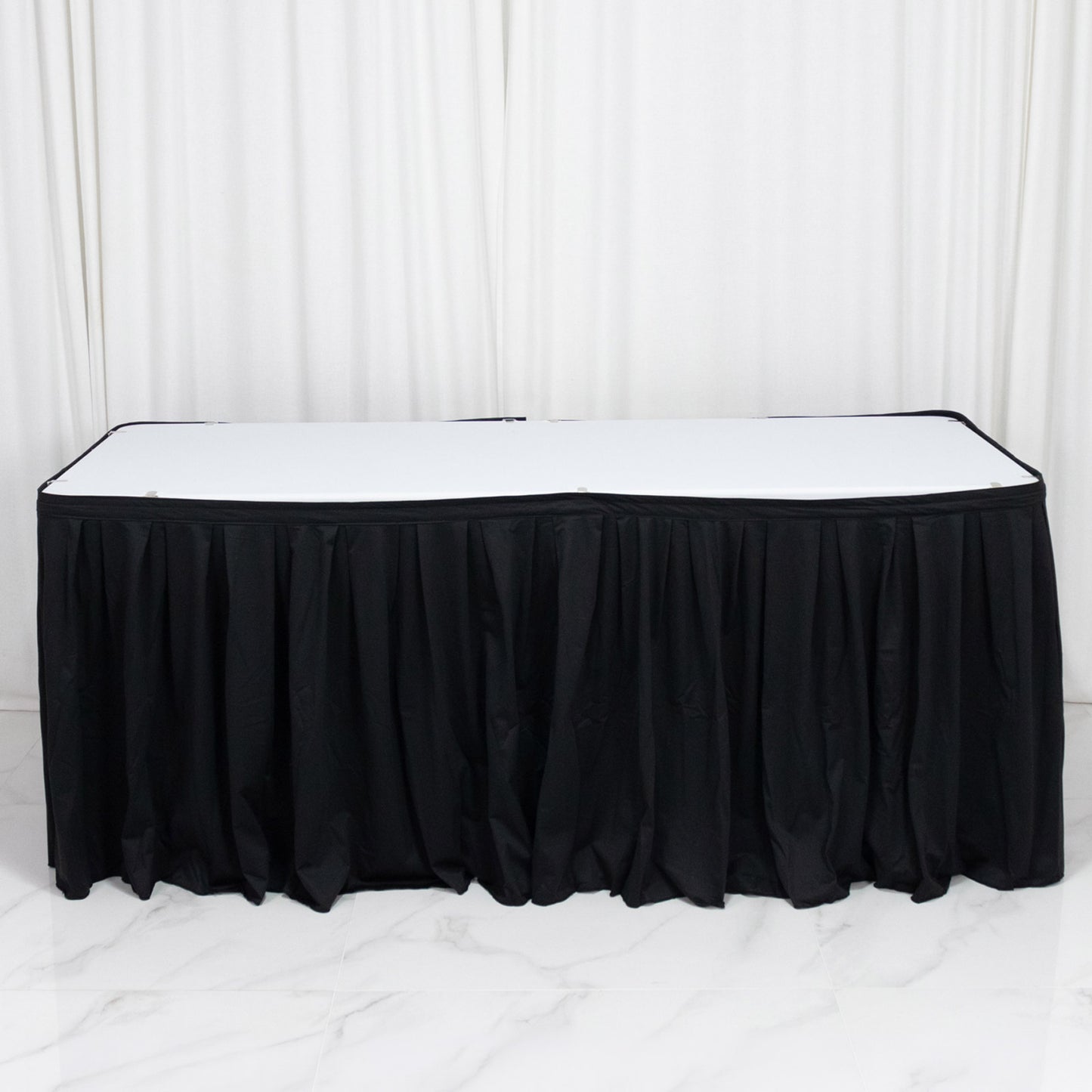 Black 17ft wrinkle-free event table skirt with shirred pleat design.