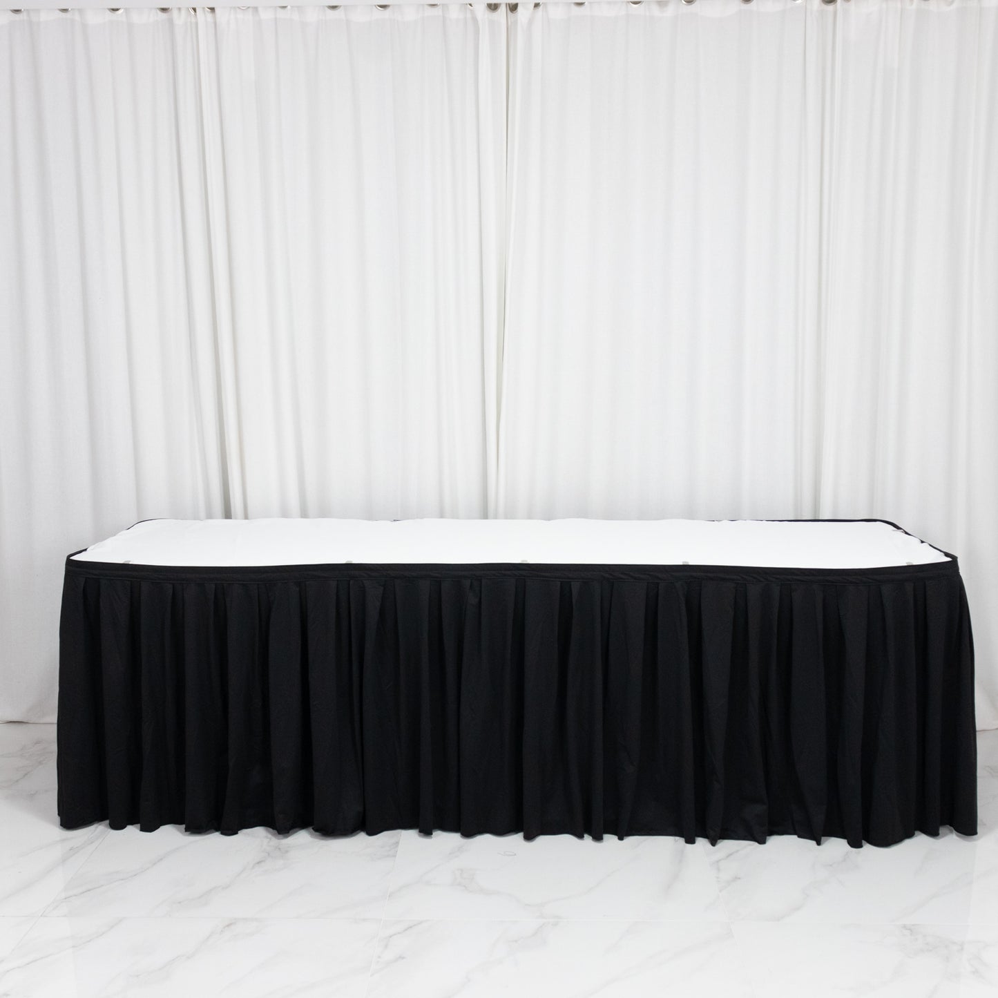 Black wrinkle-free and stain-resistant event table skirt.