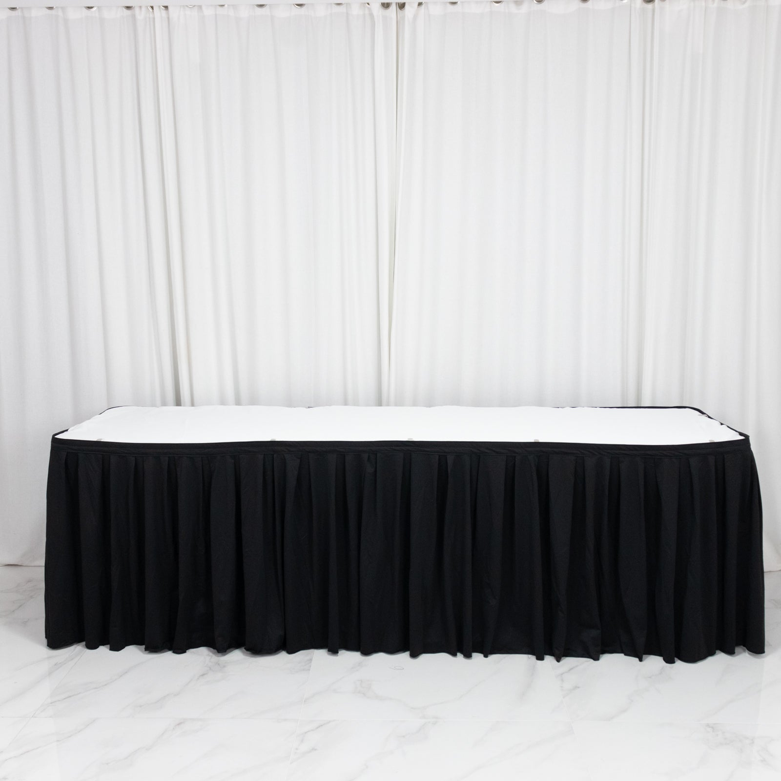 Black wrinkle-free and stain-resistant event table skirt.