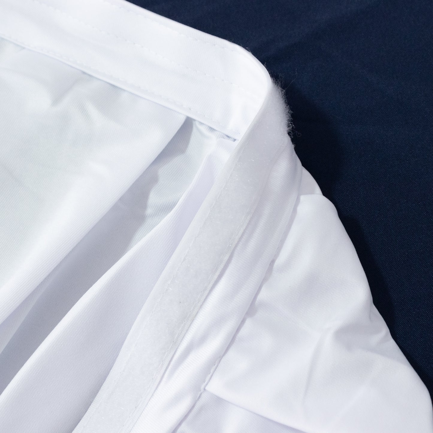 White 14ft wrinkle-free and stain-resistant event table skirt.
