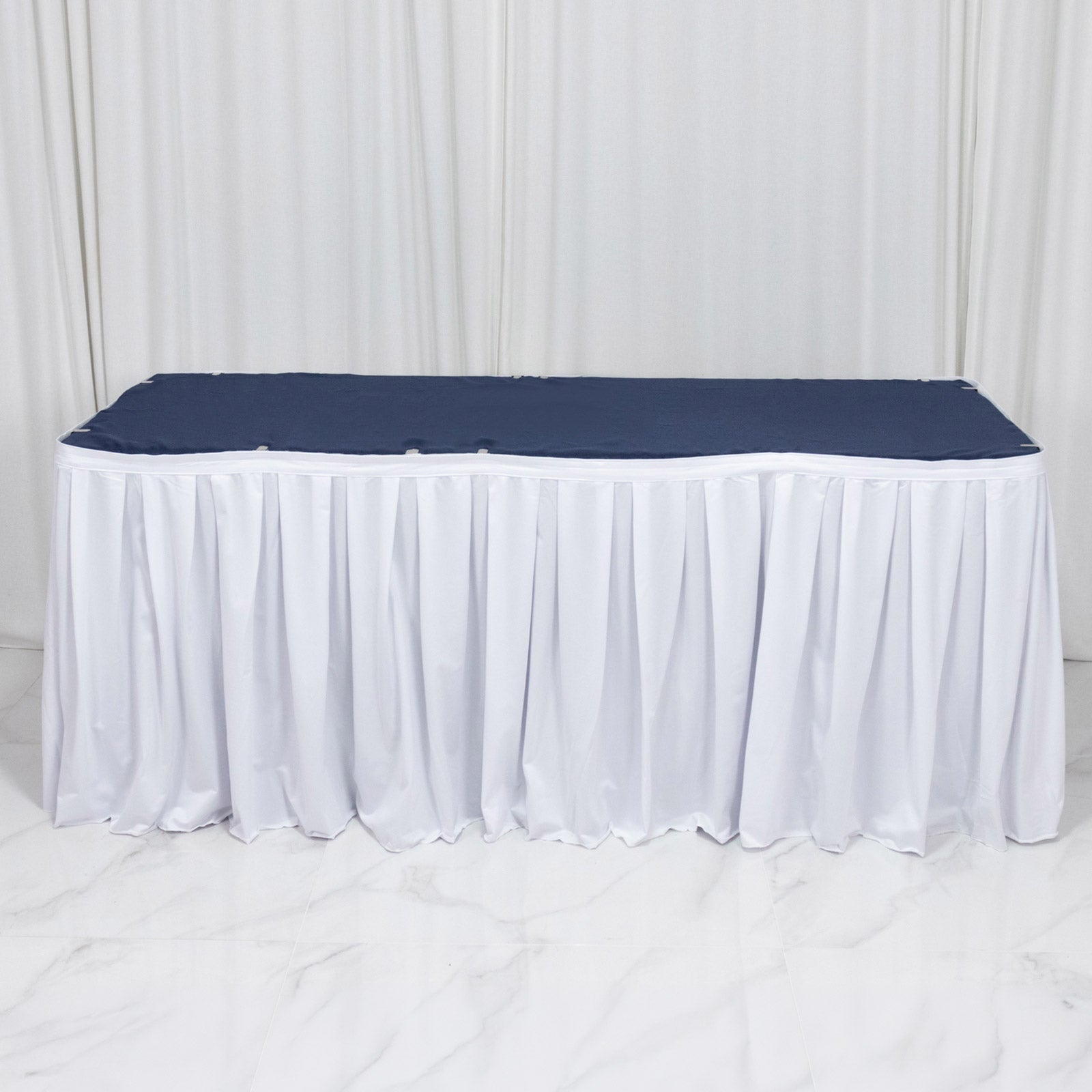 White shirred pleat table skirt for events, wrinkle-free and stain-resistant.