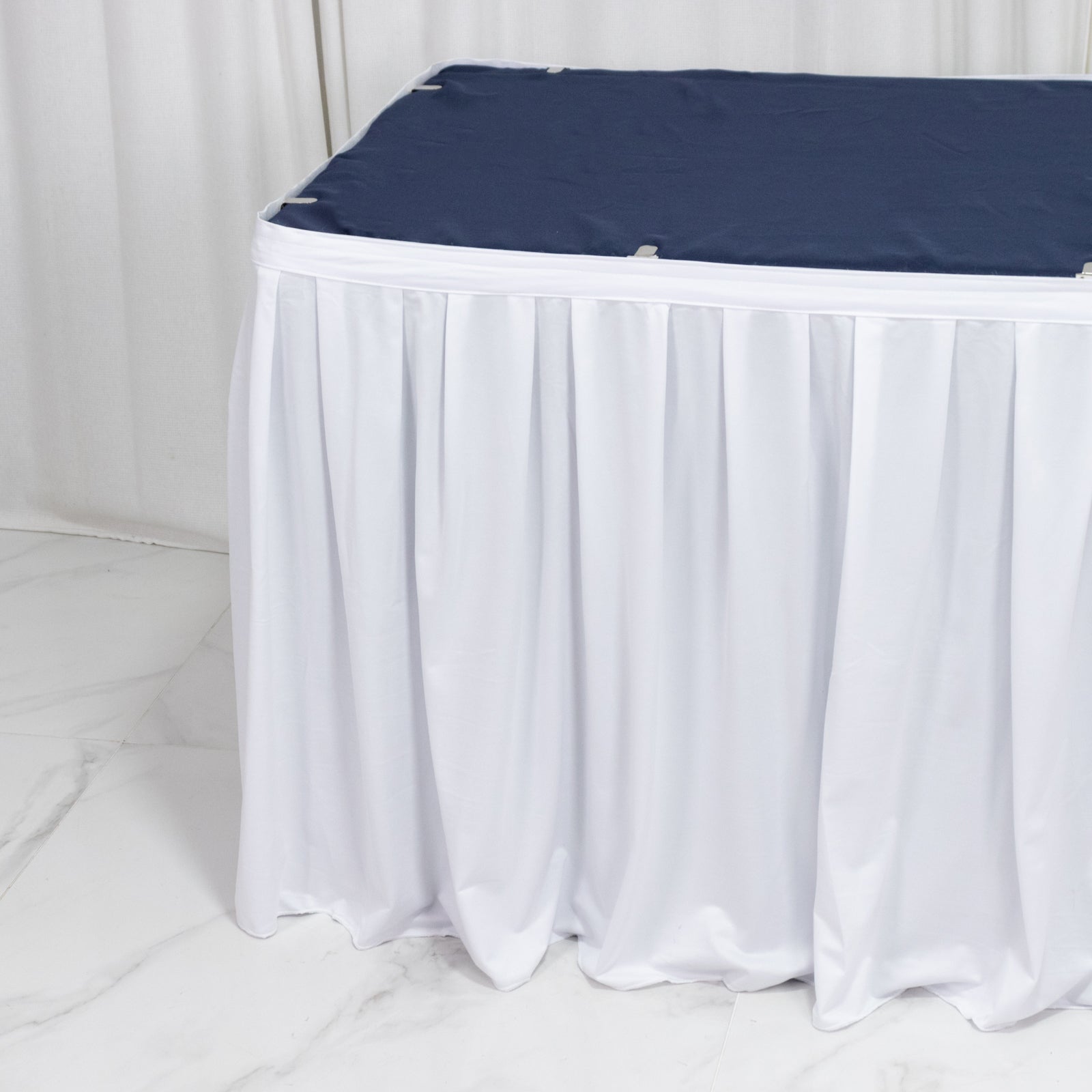 White 17ft scuba table skirt with shirred pleat, wrinkle-free and stain resistant.