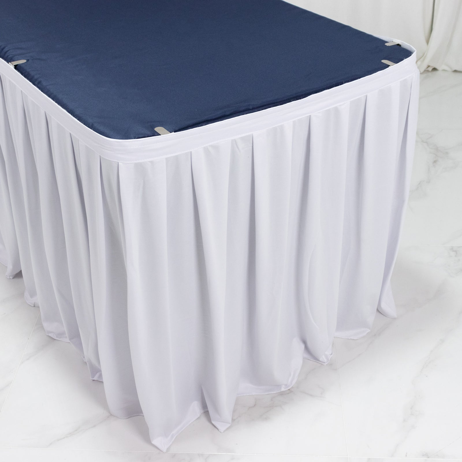 White 17ft scuba table skirt with shirred pleat, wrinkle-free and stain-resistant.