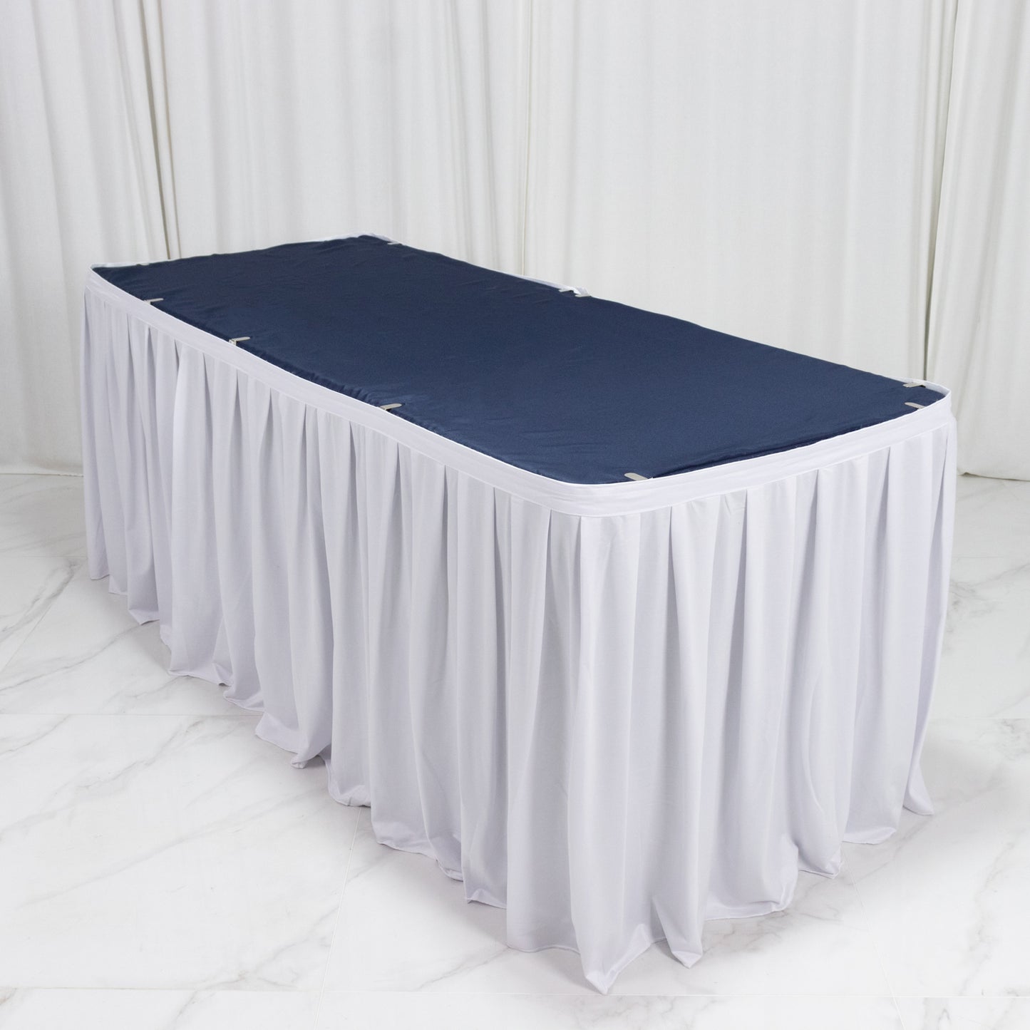 White 17ft wrinkle-free and stain-resistant scuba table skirt with shirred pleats.