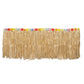 Natural raffia grass table skirt for Hawaiian themed party decorations.