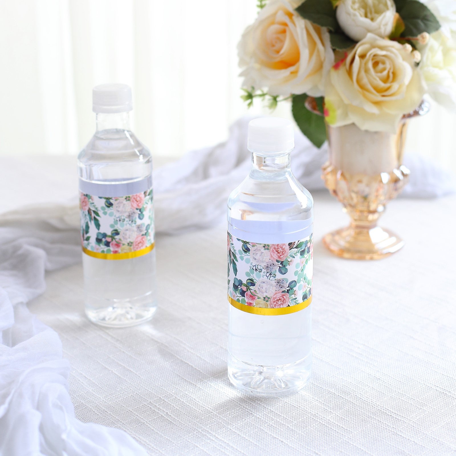 White and pink floral water bottle labels with gold trim.