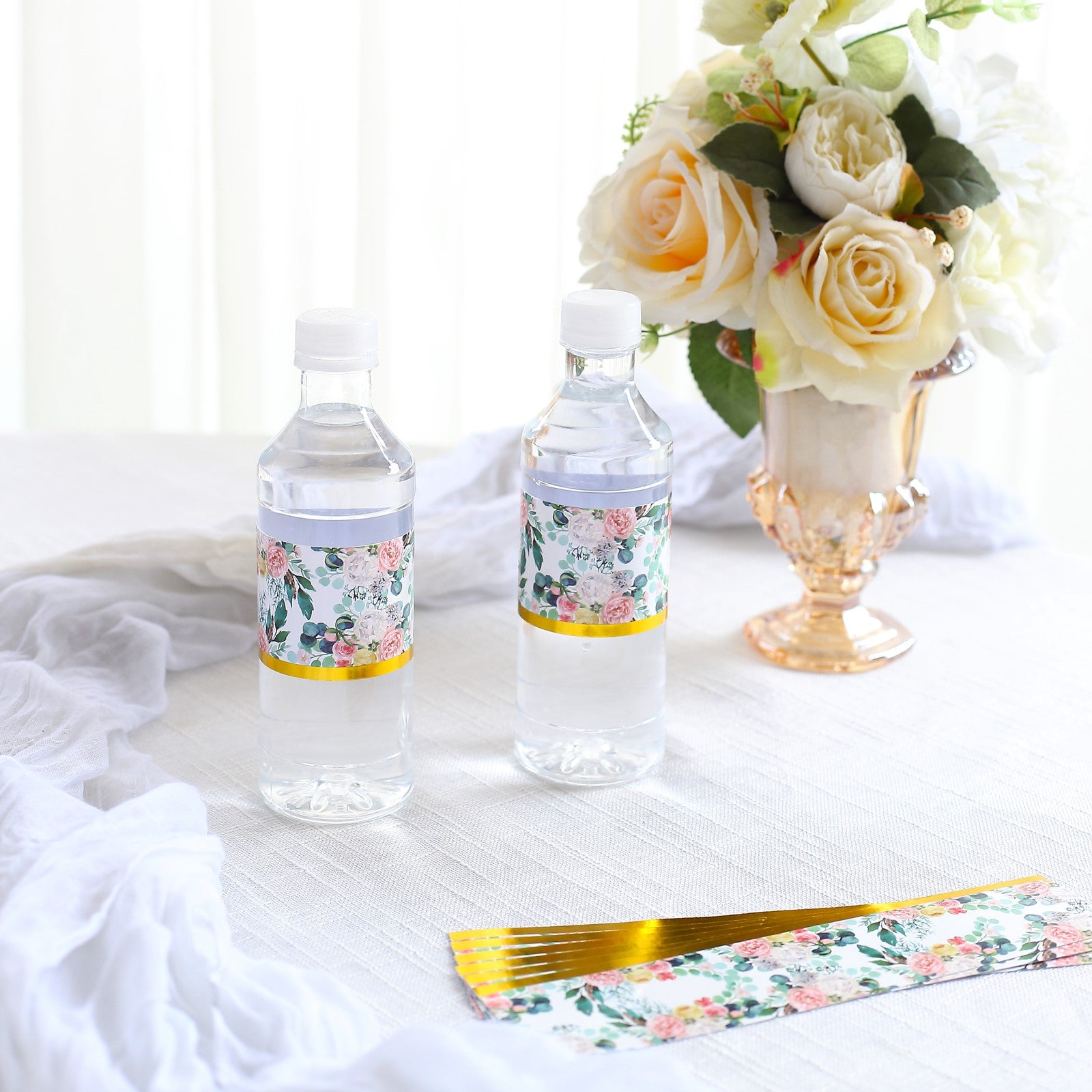 White and pink floral water bottle labels with gold trim.