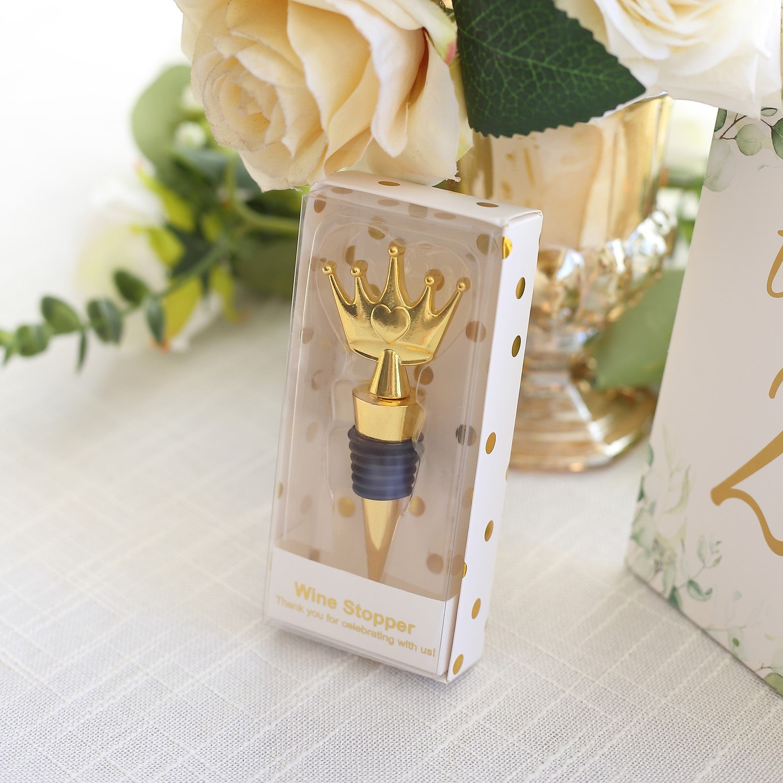 Gold princess crown wine bottle stopper in clear gift box with ribbon.
