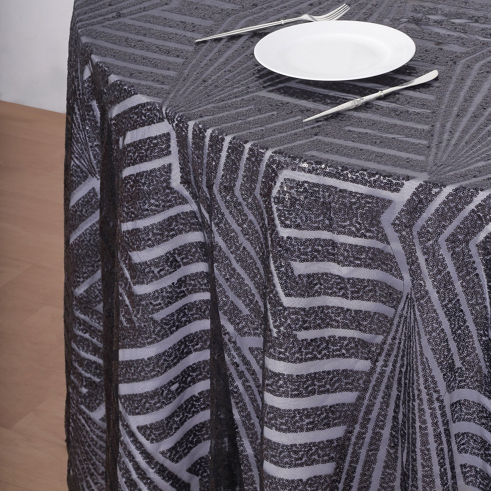 Black sequin round tablecloth for elegant dining settings.