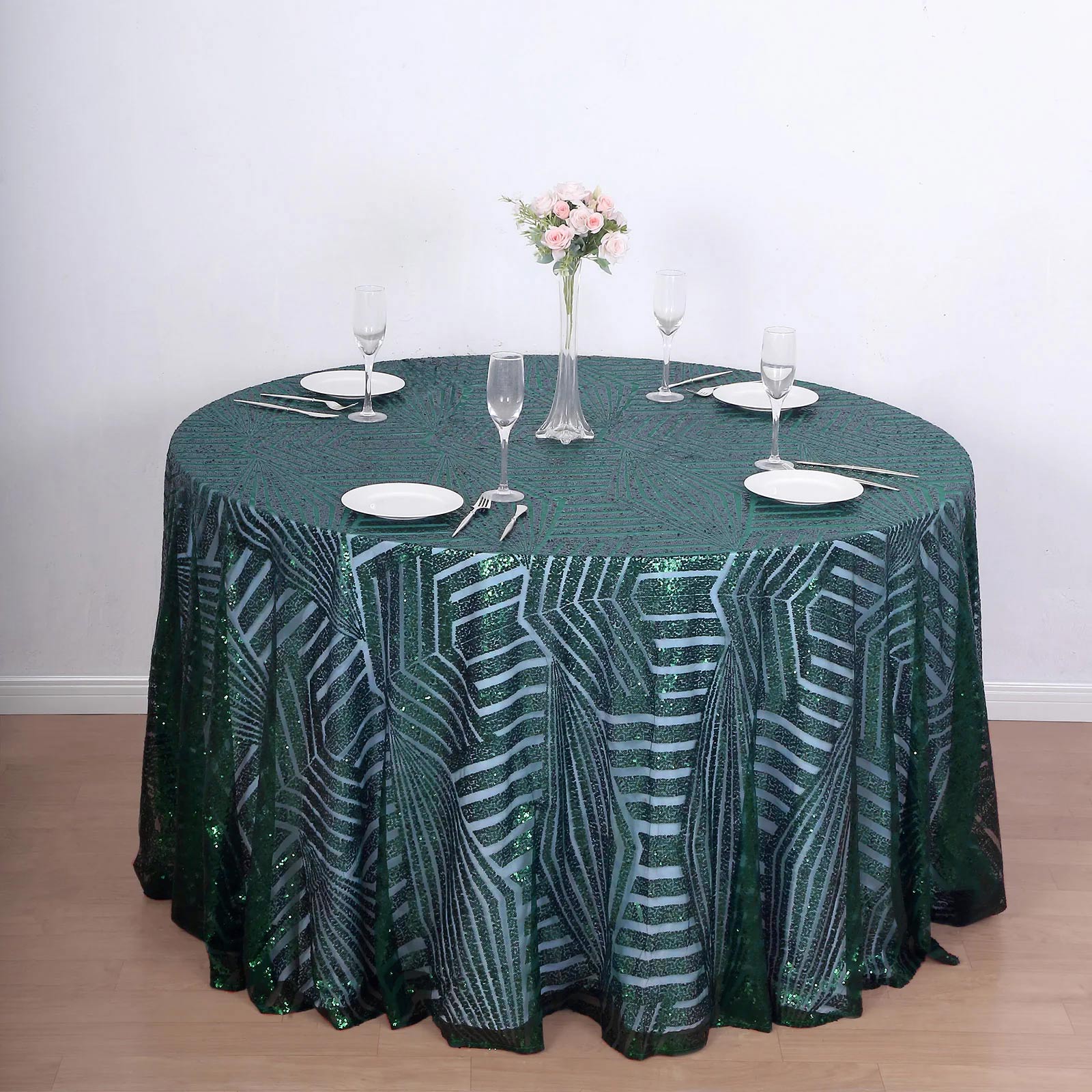 120" Hunter Emerald Green Sequin Round Tablecloth on a dining table.