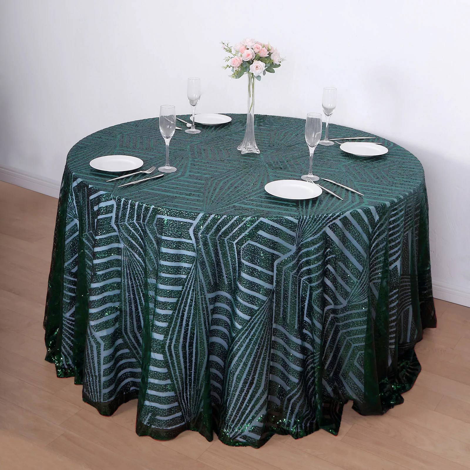 Emerald green sequin round tablecloth with a stylish leaf pattern.