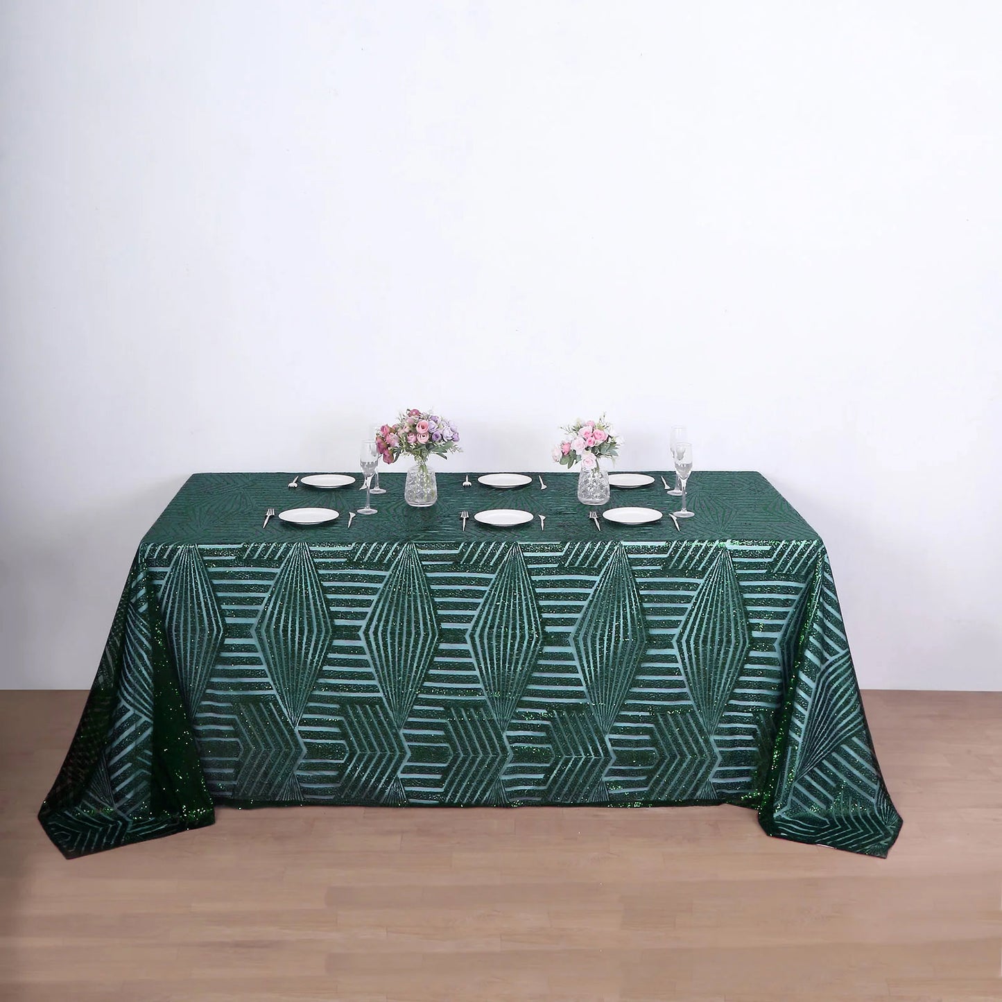Emerald green diamond sequin rectangular tablecloth on a dining table.