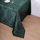 Hunter Emerald Green Sequin Tablecloth on a wooden table.