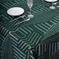 Emerald green sequin rectangular tablecloth on a dining table.