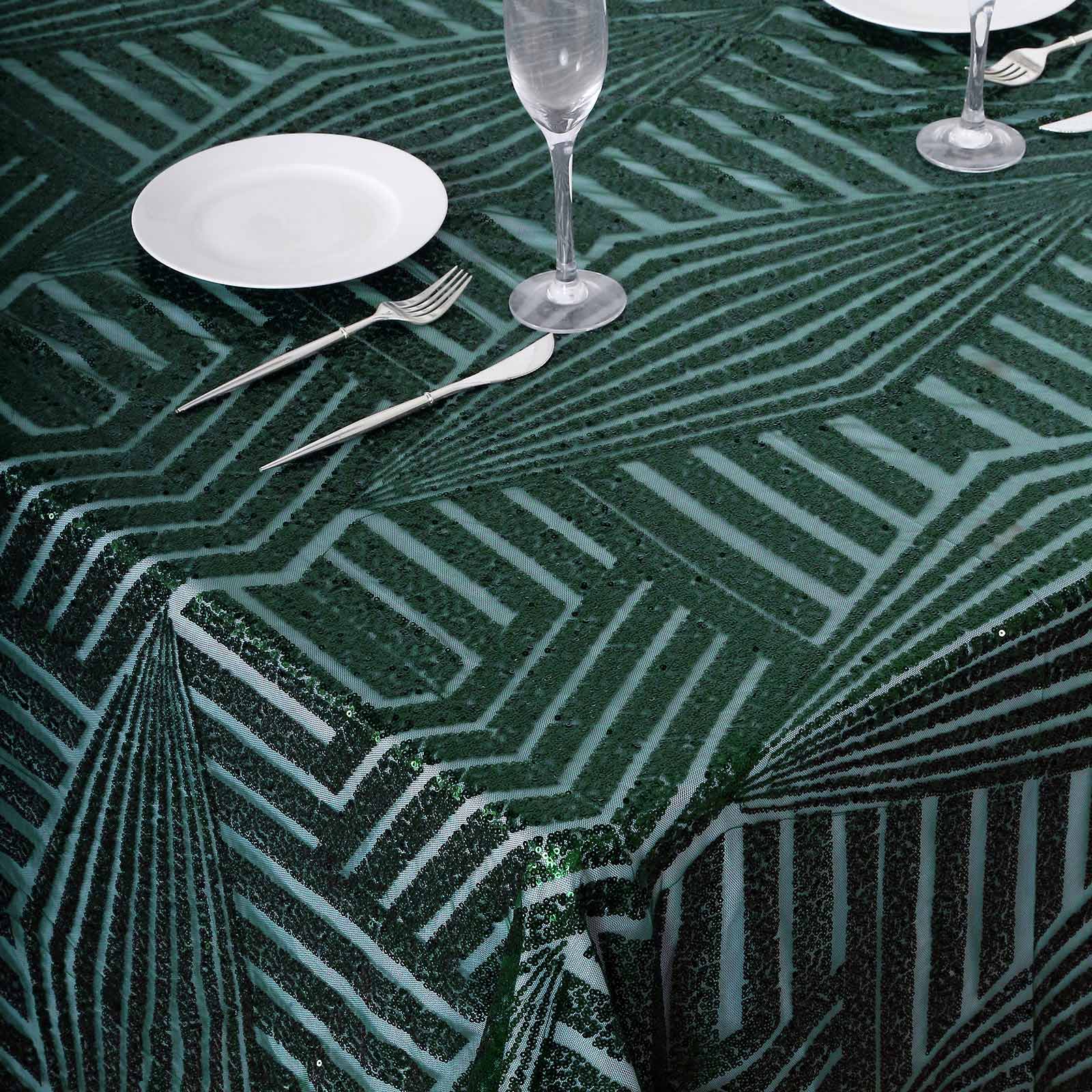 Emerald green sequin rectangular tablecloth on a dining table.