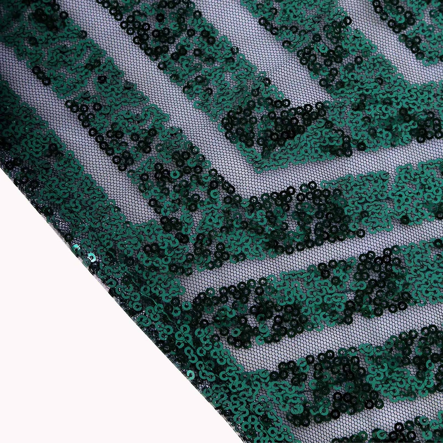 Hunter emerald green sequin tablecloth with diamond pattern.