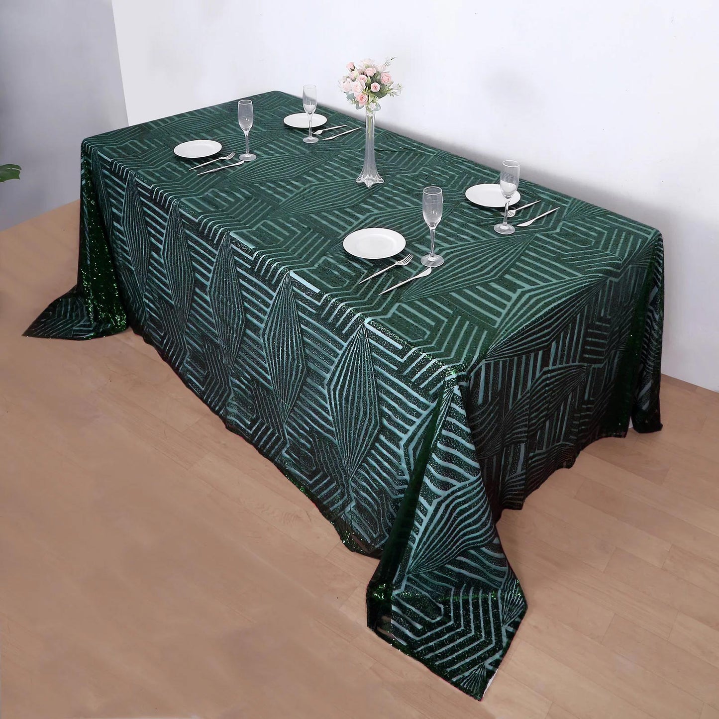 Emerald green diamond sequin tablecloth on a rectangular table setting.