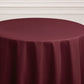 Burgundy seamless round tablecloth draping elegantly.