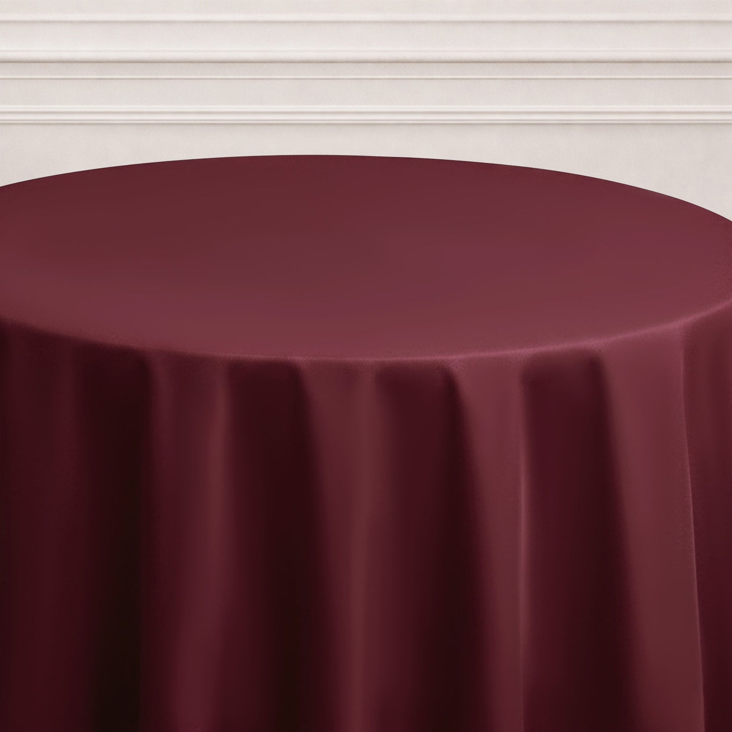 Burgundy seamless round tablecloth draping elegantly.