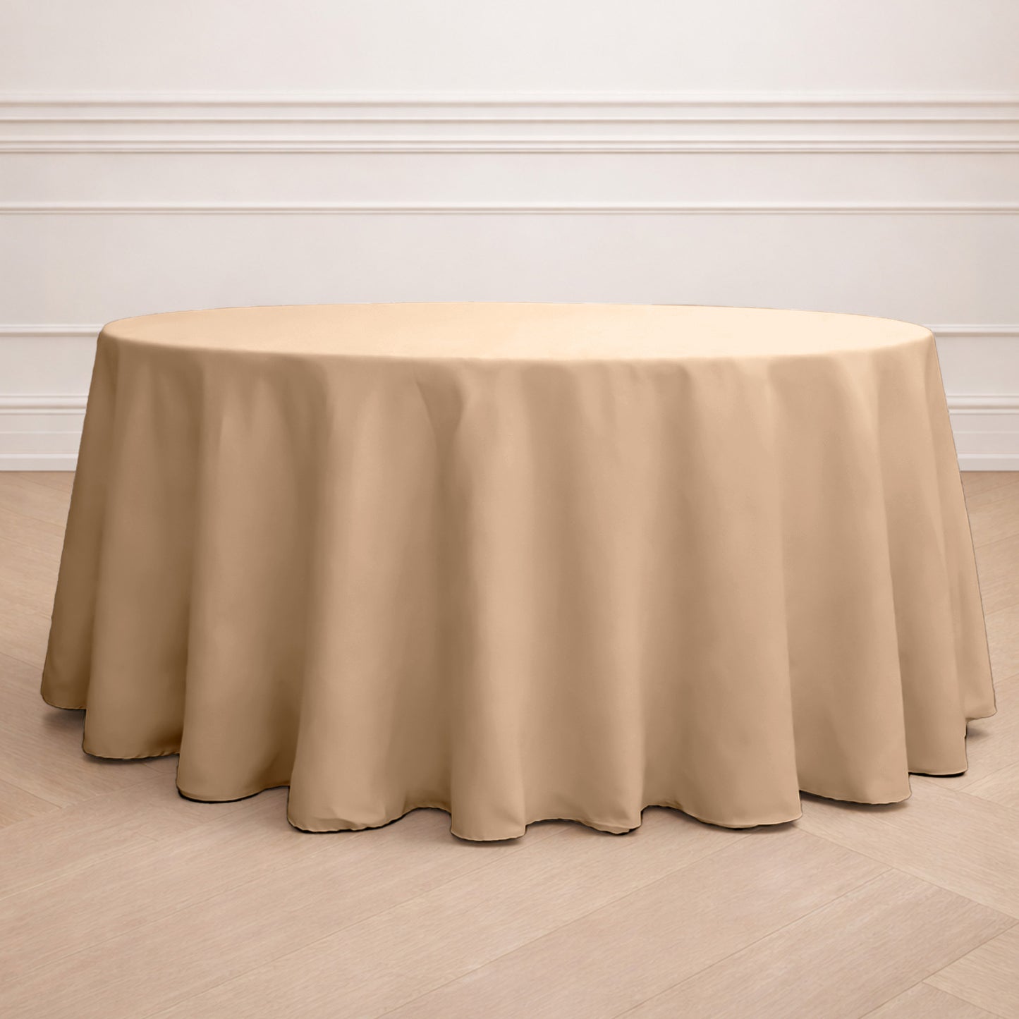 Nude seamless polyester round tablecloth for elegant dining settings.