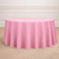 120" Pink Seamless Polyester Round Tablecloth on a wooden floor.