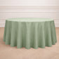 Sage green seamless round tablecloth on a wooden floor.